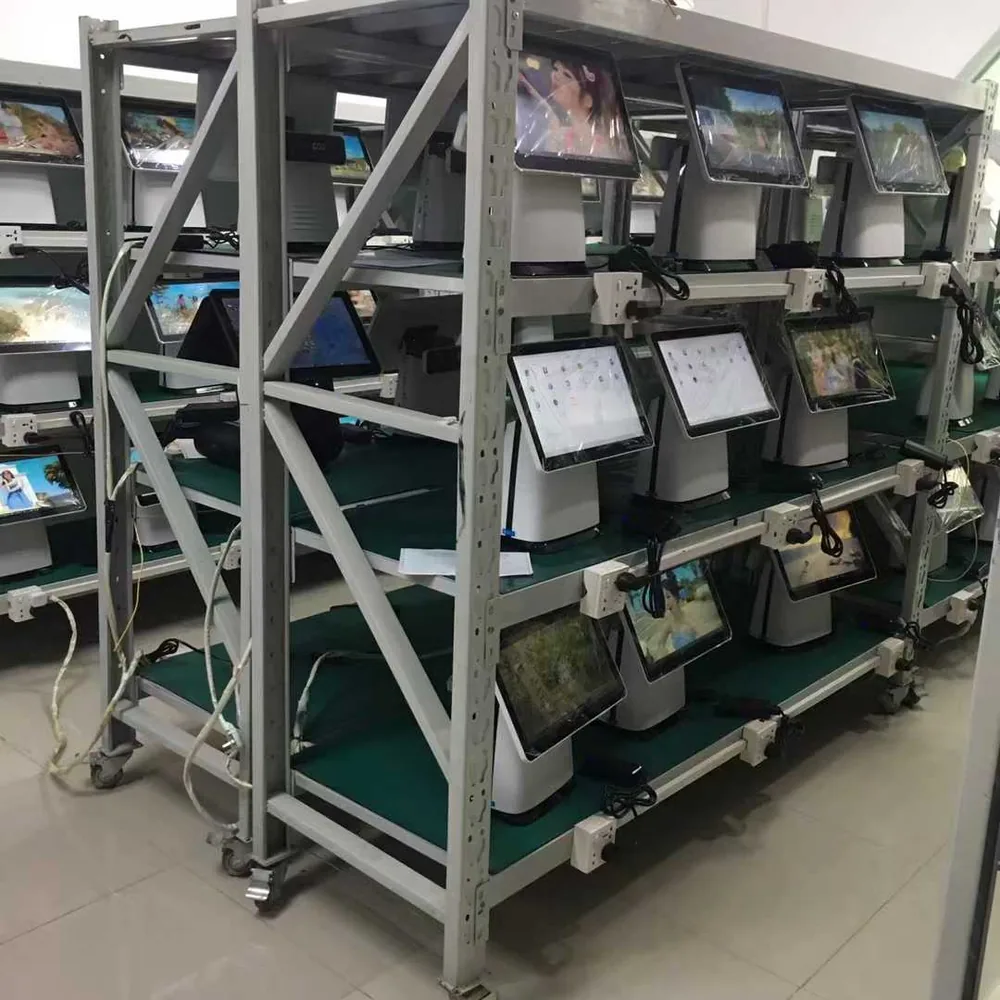 PENPOS POS terminals arranged on equipment racks for hardware review